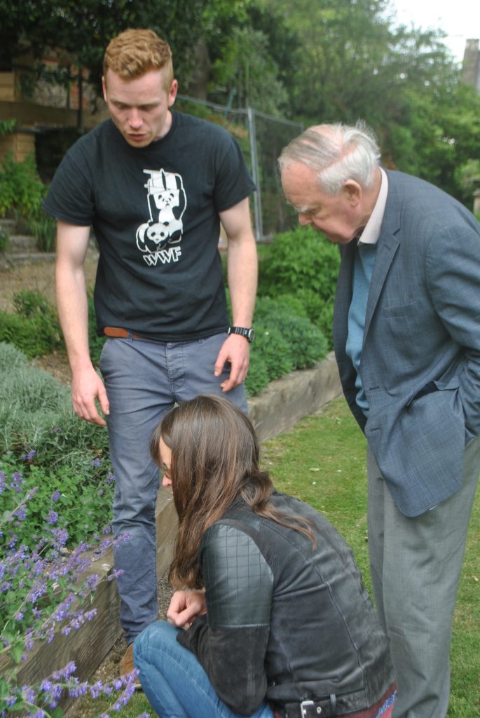 Sir Bob Reid looking at plants