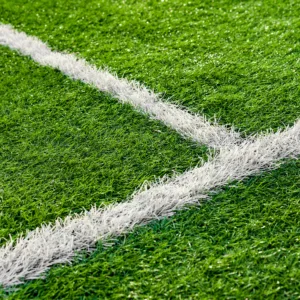 Painted White Lines Of Green Artificial Turf On Soccer Field.