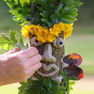 Decorated tree face with flowers